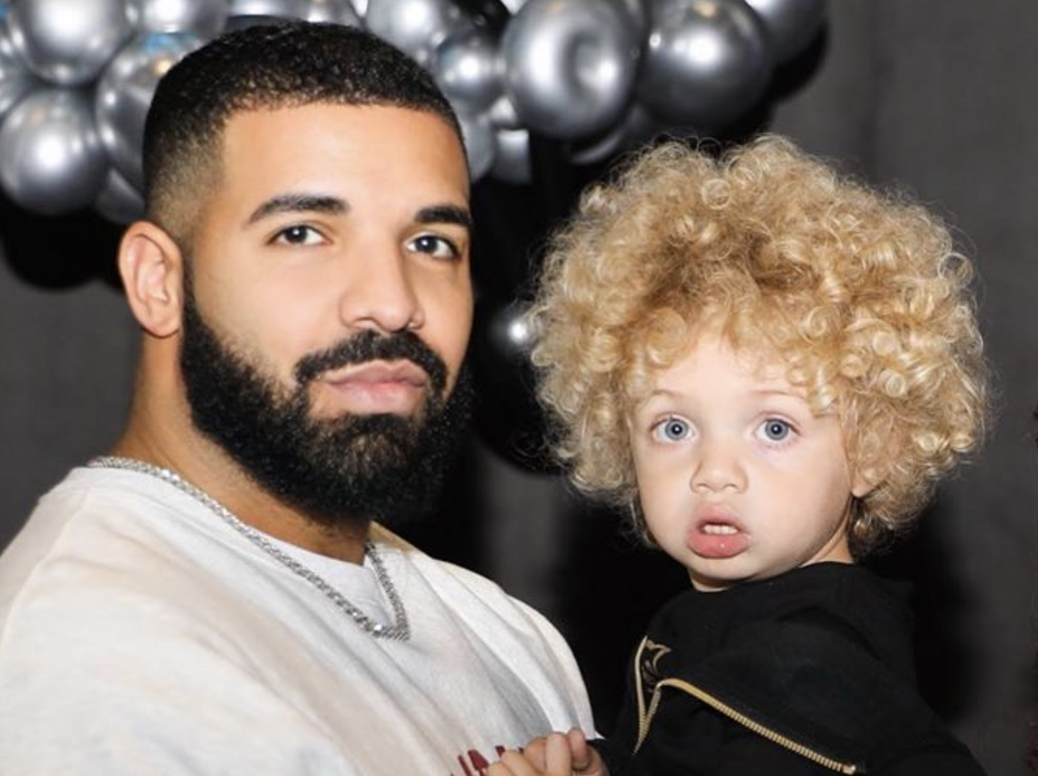 Drake shares first photos of his blond, curly haired son Adonis